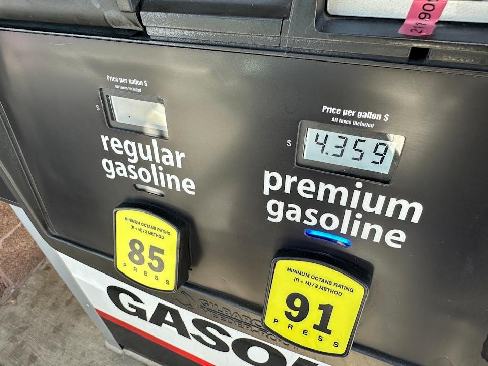 The per-gallon price for premium unleaded is displayed electronically on a pump as a motorist fills up the tank of a vehicle at Costco gasoline station Friday, March 20, 2026, in northeast Denver. (AP Photo