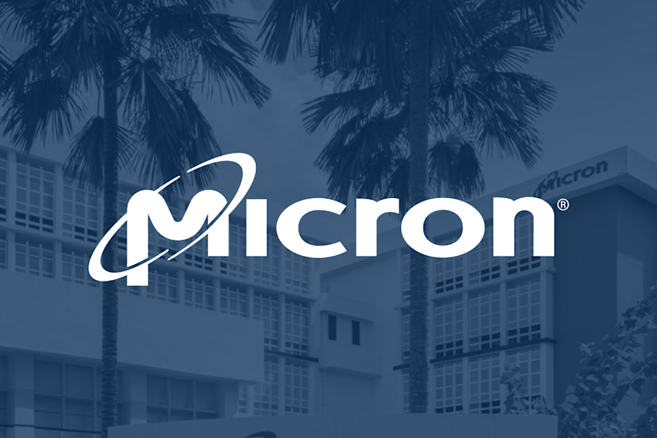 An office building with palm trees in front of it and Micron's logo overlaid.